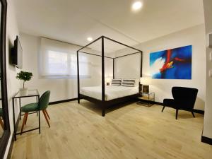 A television and/or entertainment centre at La SIGRINA Tuy