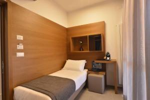 Postel nebo postele na pokoji v ubytování Piano Alto Rooms