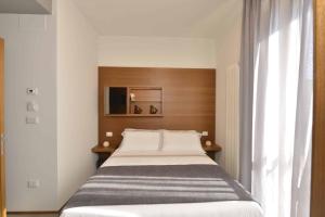 Postel nebo postele na pokoji v ubytování Piano Alto Rooms