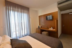 Postel nebo postele na pokoji v ubytování Piano Alto Rooms