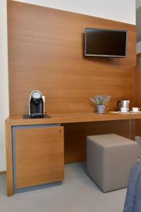 TV a/nebo společenská místnost v ubytování Piano Alto Rooms