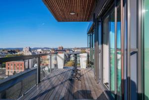 a balcony with a view of a city at Thon Hotel Opera in Oslo