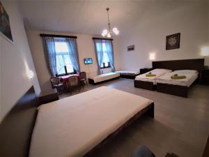 Postel nebo postele na pokoji v ubytování Hotel Olga