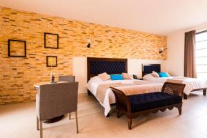 Ліжко або ліжка в номері Hotel Los Frailes, Valladolid, Yucatán