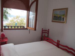 A bed or beds in a room at Luci del Golfo