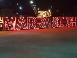 a lit up sign with the words emergency at Appartement Andalou in Marrakesh