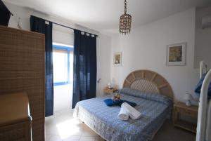 Postel nebo postele na pokoji v ubytování Villa Flora Studios & Apartments
