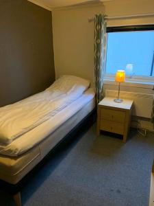 Postel nebo postele na pokoji v ubytování Mosjøen Overnatting, Cm havigs gate 18