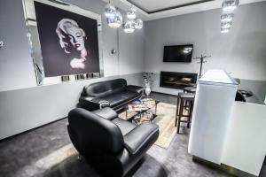 TV a/nebo společenská místnost v ubytování Hotel Luna