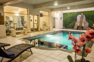 a large swimming pool in a room with at Plaza de Oro in Monterrey