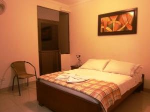 Postel nebo postele na pokoji v ubytování Hotel Shalom PHE Guaduas