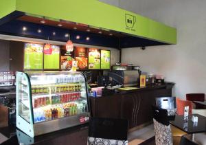 a fast food restaurant with a drink cooler in the foreground at MaxOneHotels.com at Sabang in Jakarta