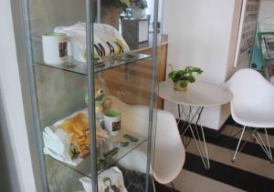 a glass shelf with food and a teddy bear in it at MaxOneHotels.com at Sabang in Jakarta