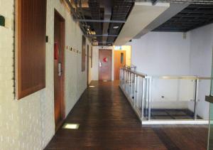 a hallway in a building with a stairway and a door at MaxOneHotels.com at Sabang in Jakarta