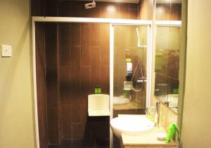 a bathroom with a toilet and a sink and a shower at MaxOneHotels.com at Sabang in Jakarta