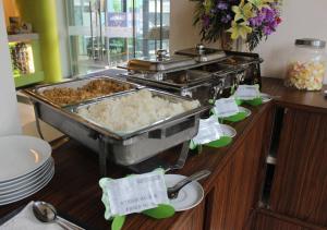 a buffet with some food on a table at MaxOneHotels.com at Sabang in Jakarta