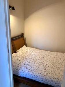 מיטה או מיטות בחדר ב-Immeuble de charme La Tronche
