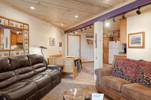 a living room with a couch and a table at Lodgepole Condos in Silverthorne