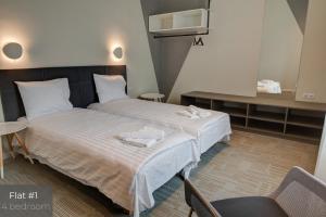 Postel nebo postele na pokoji v ubytování Dandelion Apartments Matīsa