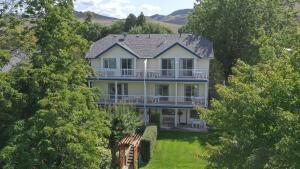 an aerial view of a large house with trees at Lakeside Country Inn in Savona