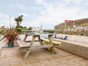 a picnic table on the roof of a house at Offshore in Porthtowan
