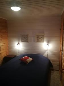 Postel nebo postele na pokoji v ubytování Koivulankaari 4A