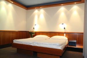 Łóżko lub łóżka w pokoju w obiekcie Prielmayerhof HOTEL