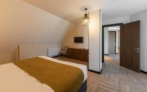 Voodi või voodid majutusasutuse KOMOREBI BAKURIANI RESORT toas
