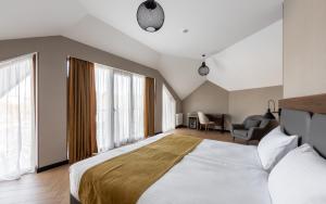 Voodi või voodid majutusasutuse KOMOREBI BAKURIANI RESORT toas