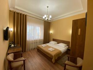 Postel nebo postele na pokoji v ubytování Сонячна Соната