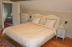 Ein Bett oder Betten in einem Zimmer der Unterkunft B&B Kasteelhoeve de Tornaco