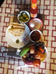 a table with plates of food on a table at Anugrah Homestay in Darjeeling