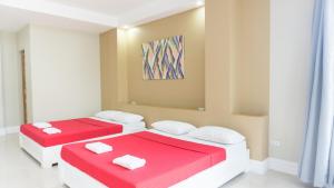 Postel nebo postele na pokoji v ubytování Sandscape Hotel