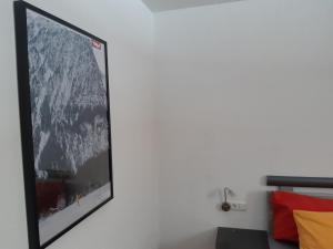 Televízia a/alebo spoločenská miestnosť v ubytovaní Apart Midi