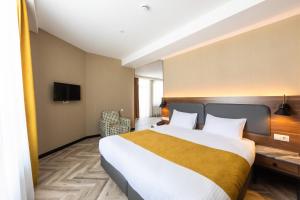 Voodi või voodid majutusasutuse KOMOREBI BAKURIANI RESORT toas