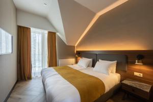Voodi või voodid majutusasutuse KOMOREBI BAKURIANI RESORT toas