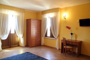 TV a/nebo společenská místnost v ubytování Hotel Palazzo Bruni