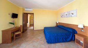 Postel nebo postele na pokoji v ubytování Hotel Palazzo Bruni