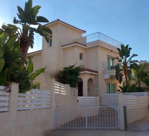 a large house with a fence in front of it at Palma Villa 14 in Protaras