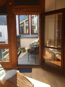 a room with sliding glass doors leading to a patio at Altstadt Ferienwohnung Wagner in Limburg an der Lahn +11 photos