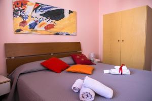 Ένα ή περισσότερα κρεβάτια σε δωμάτιο στο Casa Vacanze Soledad