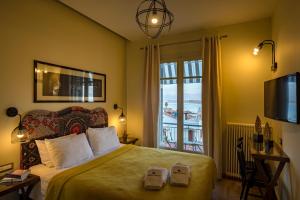 Postel nebo postele na pokoji v ubytování Leto Nuevo Hotel