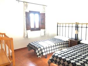 Posteľ alebo postele v izbe v ubytovaní Casa de Tita Dolores
