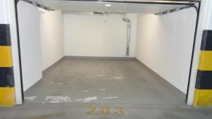 an empty garage with a concrete floor and white walls at Cvit Jadrana in Split
