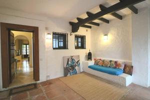 a living room with a couch and a hallway at Elegant apartment in Puerto Banus in Marbella