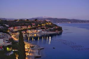 an aerial view of a town on a lake at night at CaseMaggi Attico sul Mare, Penthouse on the Sea in Portovenere