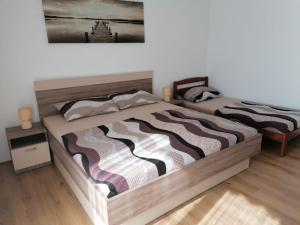 Posteľ alebo postele v izbe v ubytovaní Apartment Niva