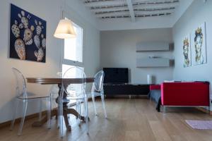 a dining room with a table and chairs at A Casa di Clara in Trapani