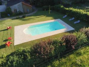 an overhead view of a swimming pool in a yard at Le Château in Champagny-sous-Uxelles +42 photos