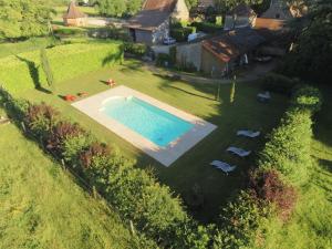 an aerial view of a backyard with a swimming pool at Le Château in Champagny-sous-Uxelles